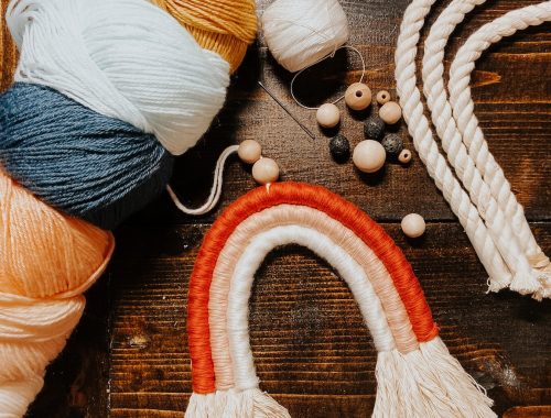 blue and orange yarn on brown wooden table